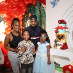 Kandi Burruss and Todd Tucker stand with their children, Ace and Blaze (dressed as a princess), at Blaze's Snow White-themed 6th birthday party, showcasing successful Kandi Todd Co-Parenting after their divorce announcement.